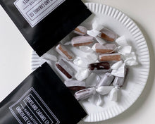 Load image into Gallery viewer, Portland Caramel Company chocolate caramels on a white plate.
